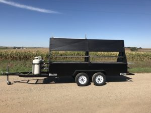 1240G with both compartment doors up, with optional rear table and holding and warming grates.